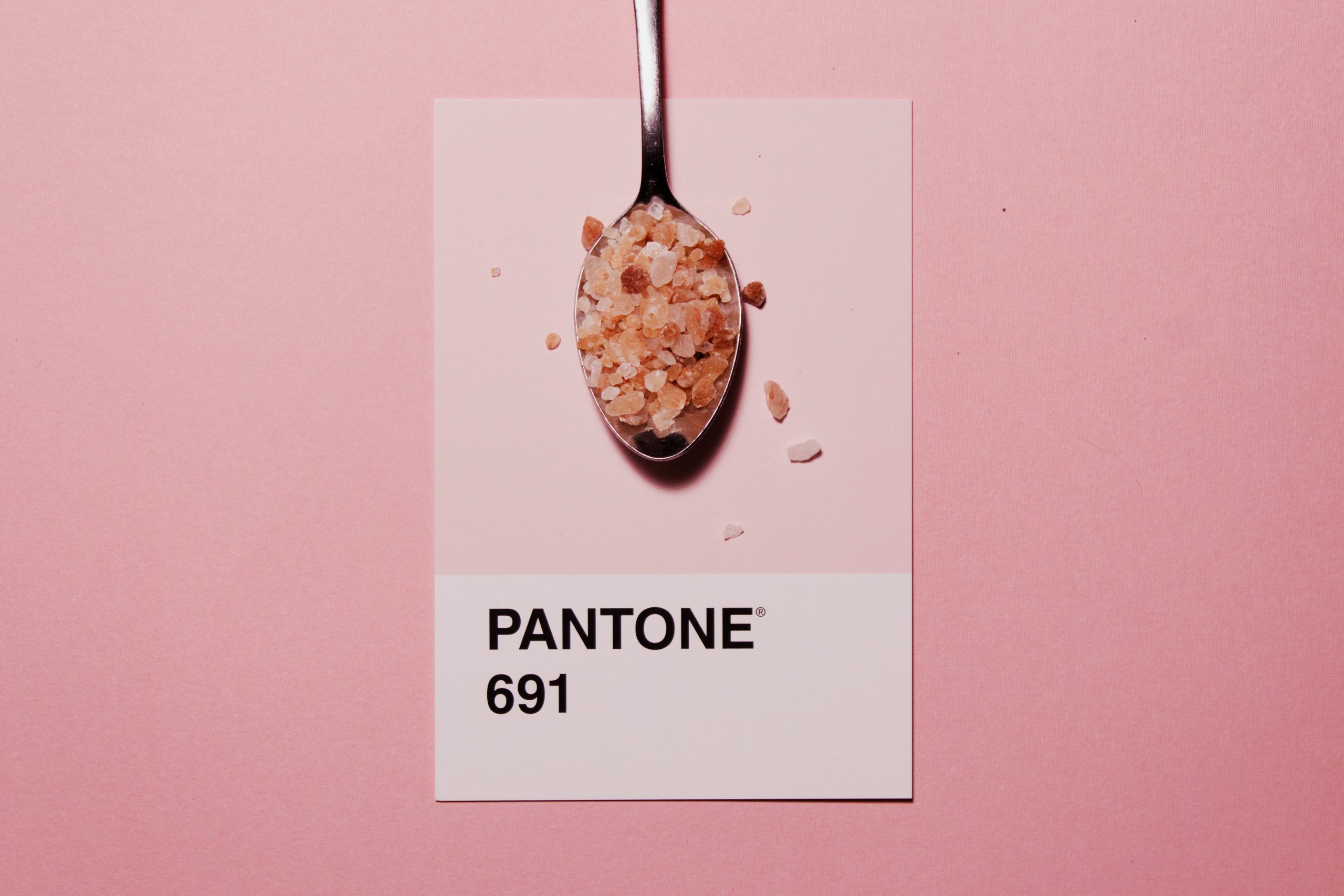 Photo by Autri Taheri silver spoon with Pantone 691 text overlay